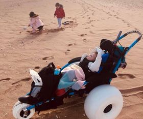 Hippocampe chair being used by very small child on the beach