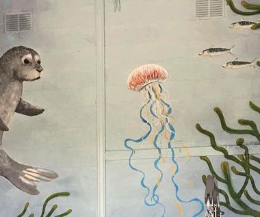 The undersea mural in The Bunker featuring a seal and jellyfish surrounded by seaweed